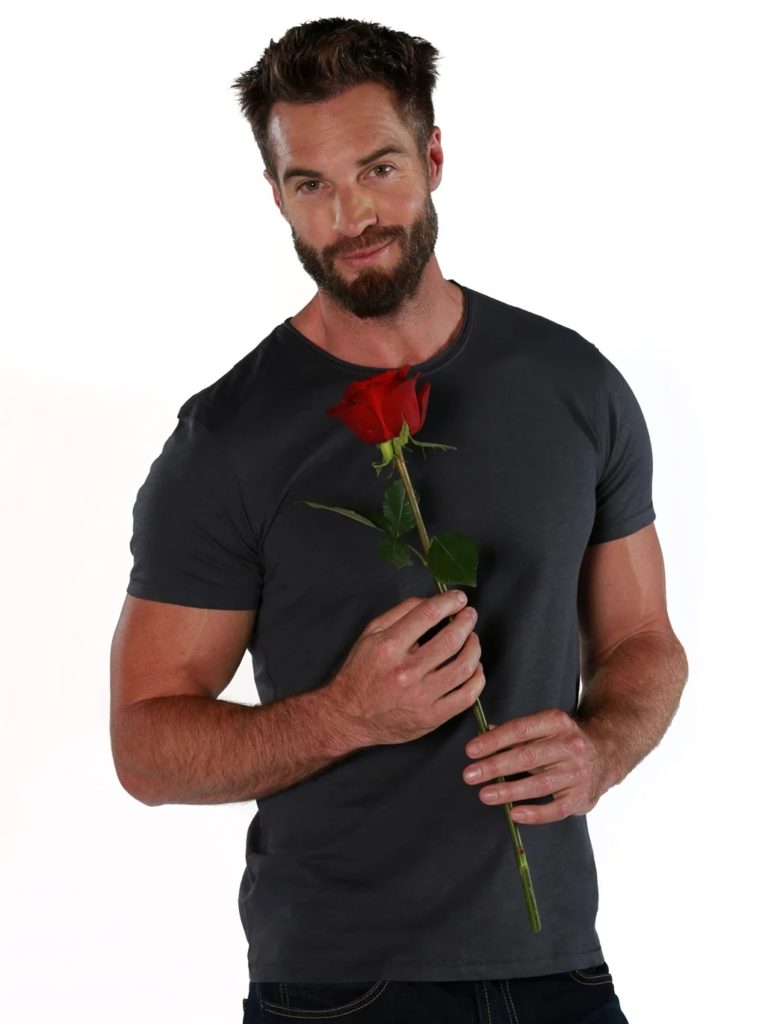 Holding a red rose in his hands, Marc Buckner is South Africa's newest Bachelor looking for love