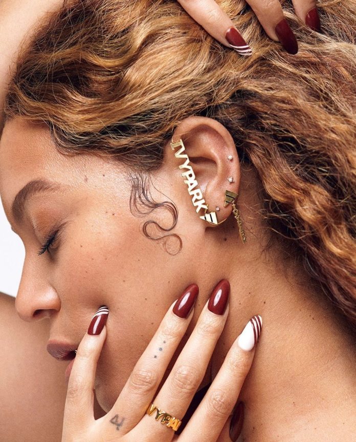 Beyonce wearing artfully designed 'Ivy Park x Adidas' ear studs