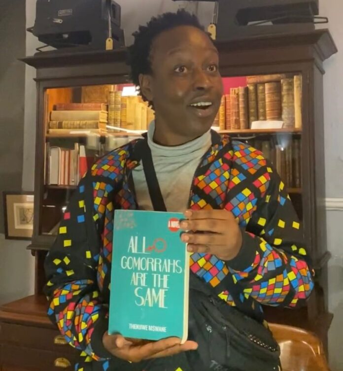 South African author Thenjiwe Mzswane pictured holding her latest book, 'All Gomorrahs Are The Same' at a bookstore