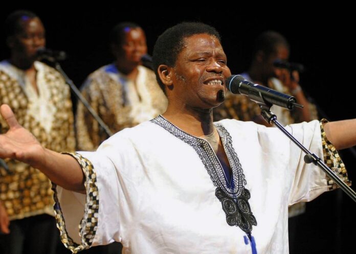 The late Ladysmith Black Mambazo founder Joseph Shabalala performing on stage.