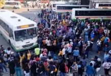 Will taxi fares go up after the fuel hike? SANTACO asks government to intervene Commuters gather around a bus at a terminal during a previous taxi strike