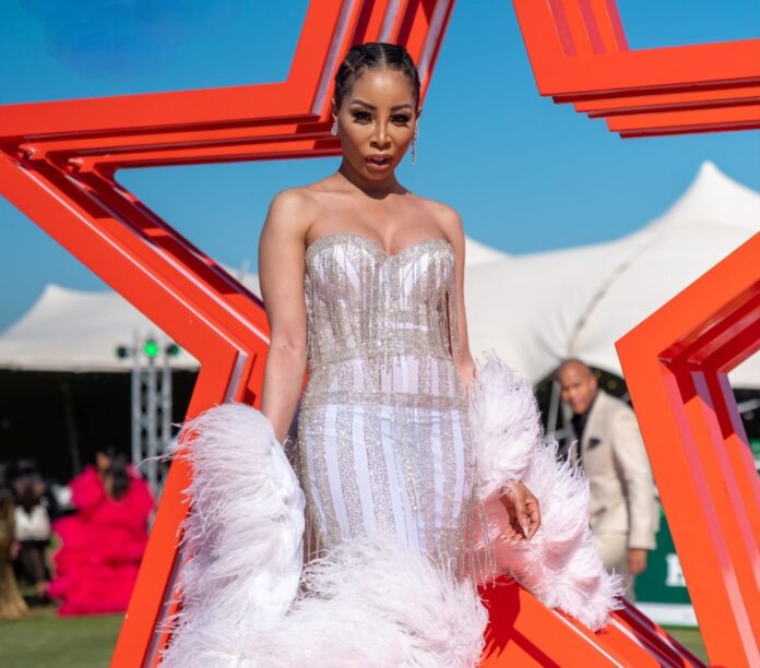 Kanyi Mbau pictured at the past Boomtown Durban July hospitality marquee