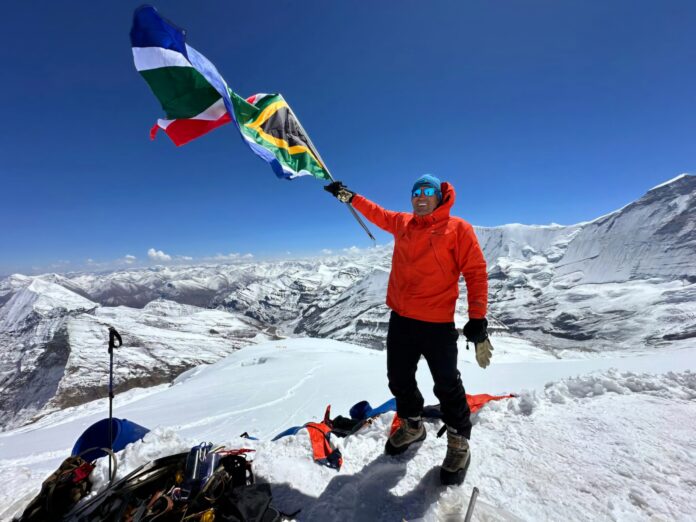 Madswimmer founder Jean Craven waves the South African flag