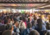 Inside Gauteng’s 200-school shortage — and the plan to fix overcrowding A dense crowd of high school learners in uniform gathered under a low metal roof at Ibongo Secondary School in Soweto, illustrating the Gauteng schools overcrowding crisis.