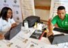 SASSA grant payment dates: The complete schedule for all 8 grants SASSA staff members assisting beneficiaries with grant payment dates on laptops.