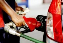 Could petrol prices ease by December? R10 billion fuel relief is on the cards Petrol nozzle refuelling a red car as the attendant holds folded banknotes.