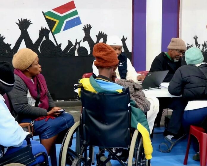 Elderly persons and people with disabilities queue at SASSA office