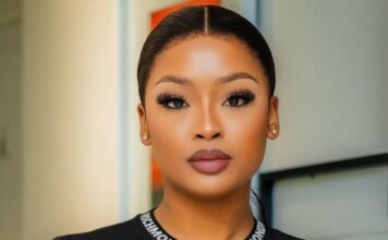 SIU responds to claims linking influencers to corruption probe A portrait of South African influencer and DJ Cyan Boujee, styled in a sleek black outfit with branded strap detailing across the neckline. She wears bold makeup with defined lashes and has her hair neatly tied back. The image is taken indoors with a softly blurred background.