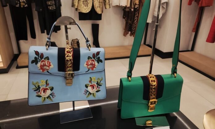 Floral Gucci luxury bags on display
