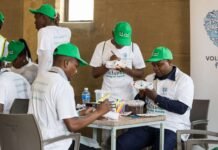 LEAP 4, VW drive STEM success in Diepsloot Volunteers painting sneakers for children.