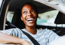 Petrol down 60c? November set to deliver the biggest fuel relief of 2025 Female driver smiling
