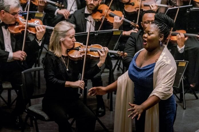 Singer and violinists perform during Mzansi Philharmonic’s Voices of Home tour.