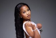 Zee Nxumalo’s next chapter — from viral star to live band powerhouse Zee Nxumalo in white dress, glowing and confident in studio portrait.