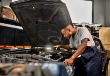 Government wants your say on next year’s minimum wage Auto worker repairs a vehicle as South Africa reviews the national minimum wage for 2027.