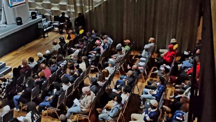 A packed audience of young music industry professionals attends the Black Coffee Foundation Music Conference.