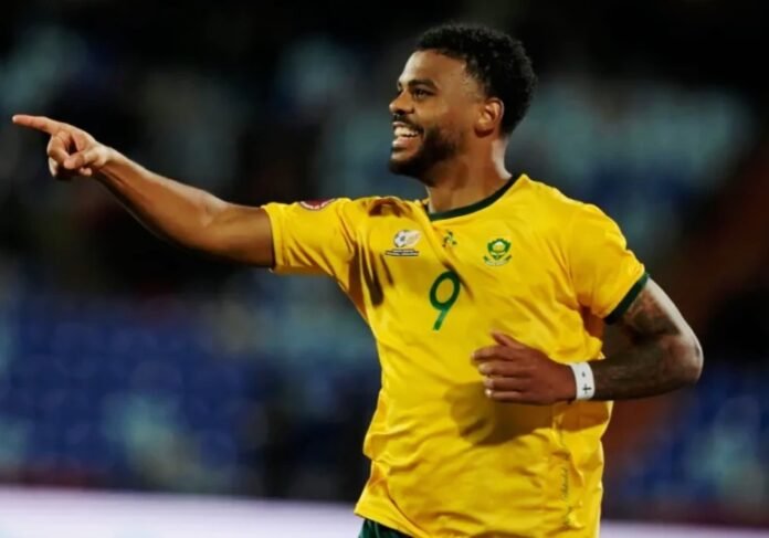 Lyle Foster in a yellow Bafana Bafana jersey with the number 9