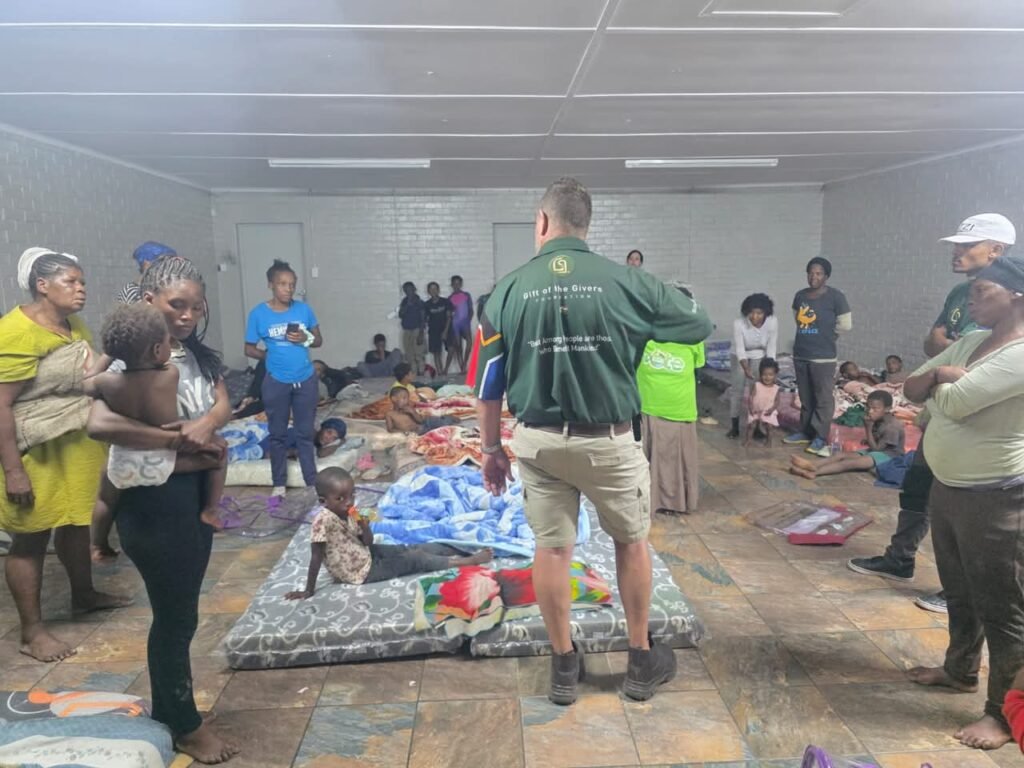 Children and adults receiving aid at a Gift of the Givers shelter
