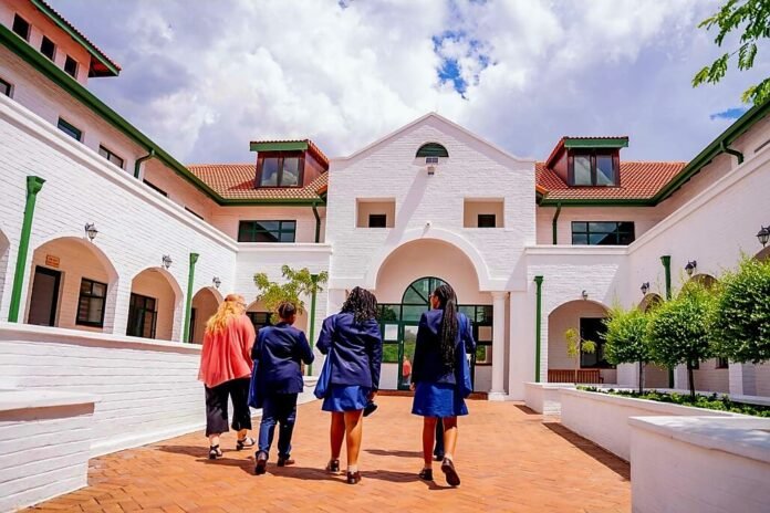 Roedean School for Girls, Johannesburg campus, learners walking in navy uniforms; 2025 IEB top-performing girls’ school, 2nd best private school in South Africa.