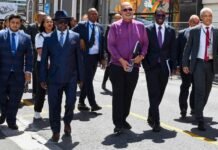 8 big wins from Budget Speech 2026 every South African should know Enoch Godongwana walks with government officials outdoors at Nieuwmeester Dome, Cape Town, before the 2026 Budget presentation.