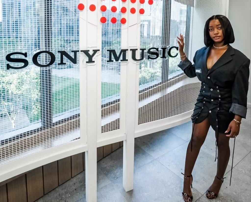 Ms. Gideon in a Sony Music office portrait, symbolising her record deal milestone.