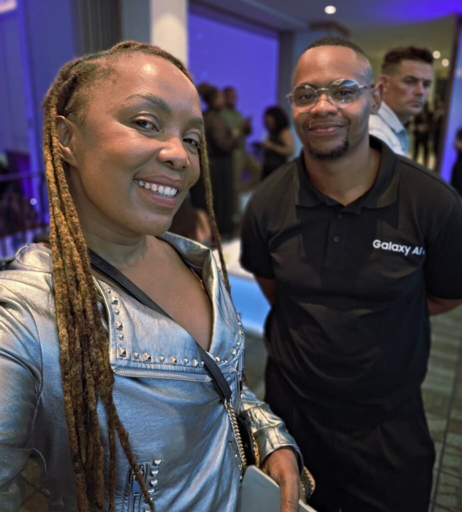 Tankiso Komane and a Samsung official at a night indoor event, captured using the Galaxy S26 Ultra selfie camera.