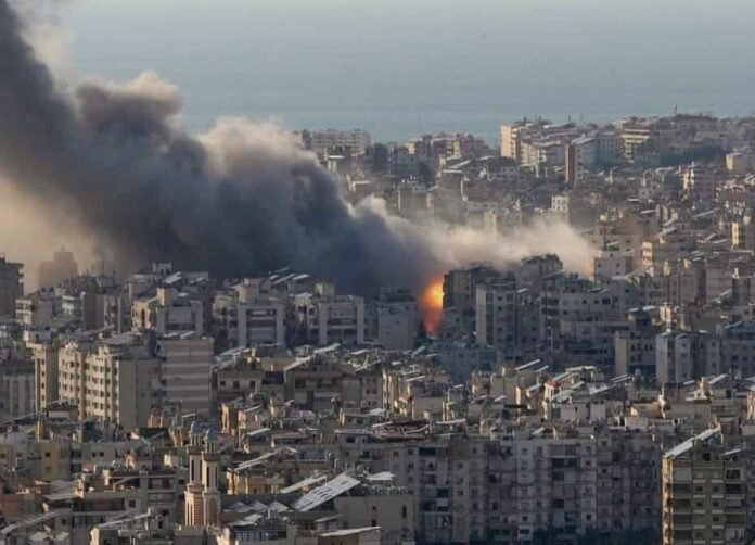 Smoke billows over Beirut’s southern suburbs after Israeli airstrikes as the Israel-Iran war expands across the Middle East.