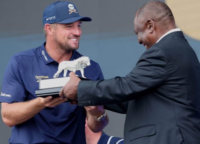 President Cyril Ramaphosa presenting the individual winner's trophy to Bryson DeChambeau at the conclusion of the inaugural LIV Golf South Africa tournament at Steyn City.