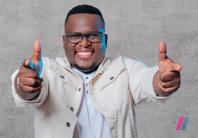 Phenduka smiling in a studio portrait promoting his Showmax special This Body Works For Me Renion.