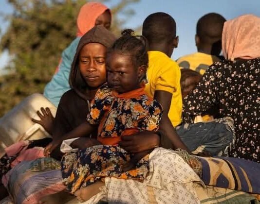 Sudan war: Chemical weapons allegations fuel calls for global probe Sudanese children and families displaced by war sit with belongings, reflecting the humanitarian crisis and impact of conflict on civilians.