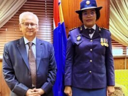President appoints acting police commissioner as Masemola faces PFMA charges over R360m tender Firoz Cachalia and Acting SAPS National Commissioner Puleng Dimpane stand side by side in formal attire in front of a South African flag.