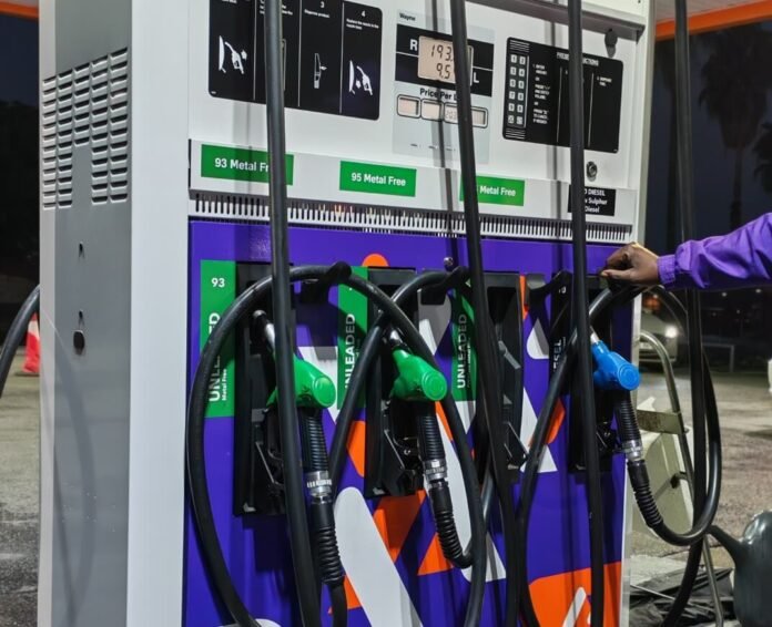 Fuel pump showing petrol and diesel nozzles with price display at a South African station