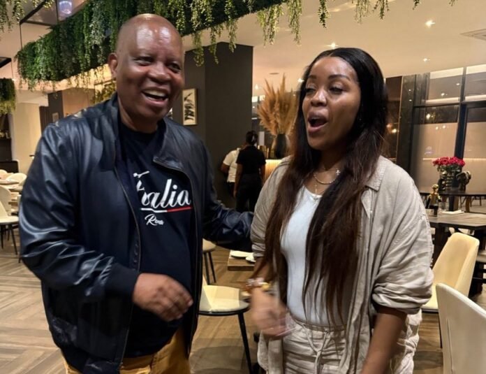 Herman Mashaba with Jacinta Ngobese at a restaurant during a conversation.