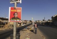 Victory for the vulnerable: Joburg council passes EFF debt relief motion EFF election poster featuring Julius Malema on a street pole in a Johannesburg township setting.