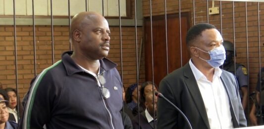 Ekurhuleni city manager in court as Tshwane CFO faces tender fraud case Julius Mkhwanazi (left) and Kagiso Lerutla (right) in the Boksburg Magistrate's Court dock on 20 April 2026. The court postponed their bail hearing to April 23, 2026.