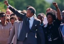 16 iconic quotes to redefine your perspective this South Africa Freedom Day Nelson Mandela and Winnie Madikizela-Mandela walking hand in hand after his 1990 release from Victor Verster Prison, both raising clenched fists in the Amandla salute.