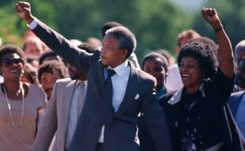 16 iconic quotes to redefine your perspective this South Africa Freedom Day Nelson Mandela and Winnie Madikizela-Mandela walking hand in hand after his 1990 release from Victor Verster Prison, both raising clenched fists in the Amandla salute.