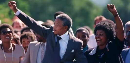 16 iconic quotes to redefine your perspective this South Africa Freedom Day Nelson Mandela and Winnie Madikizela-Mandela walking hand in hand after his 1990 release from Victor Verster Prison, both raising clenched fists in the Amandla salute.