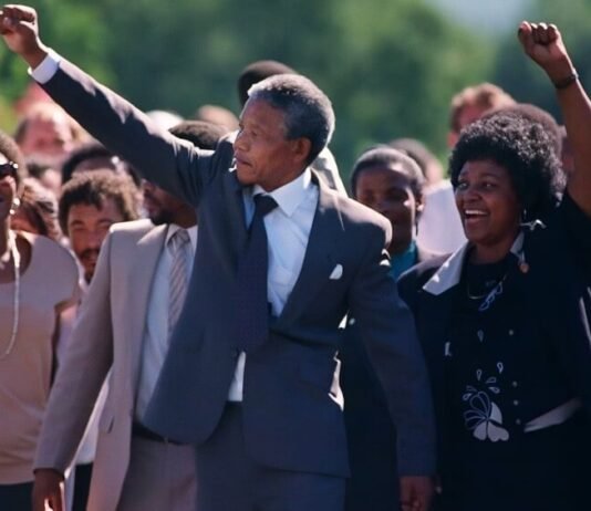 16 iconic quotes to redefine your perspective this South Africa Freedom Day Nelson Mandela and Winnie Madikizela-Mandela walking hand in hand after his 1990 release from Victor Verster Prison, both raising clenched fists in the Amandla salute.