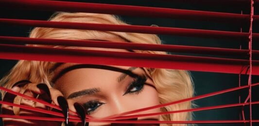 7 nominations, zero wins: what happened to Zee Nxumalo at the Metros? Zee Nxumalo portrait with red blinds and dramatic lighting