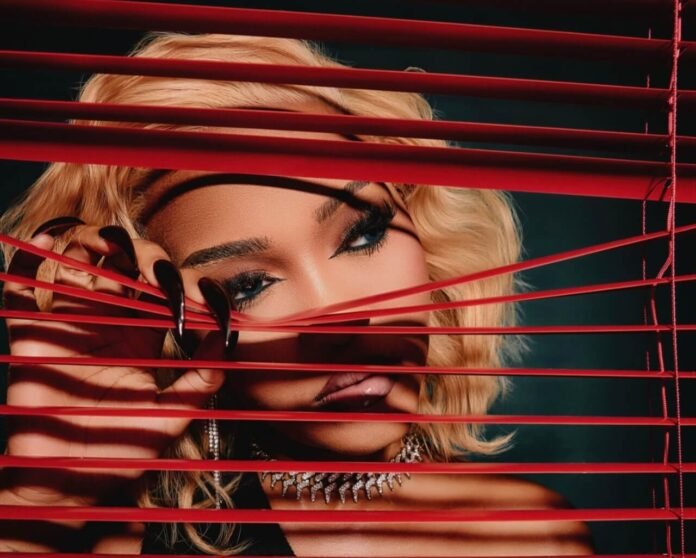 Zee Nxumalo portrait with red blinds and dramatic lighting