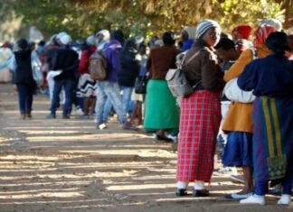 ZEP holders can apply for permanent residency in South Africa — no auto approval Zimbabweans queue outside a Home Affairs office in Harare to apply for passports.