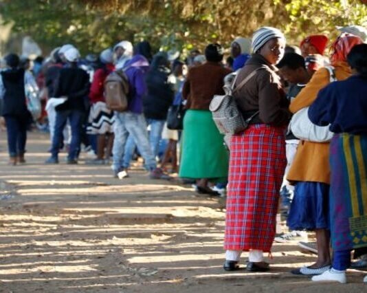 ZEP holders can apply for permanent residency in South Africa — no auto approval Zimbabweans queue outside a Home Affairs office in Harare to apply for passports.