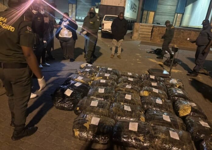 BMA and SAPS officials at Beitbridge Port of Entry stand beside 713kg of seized methaqualone linked to a nearly R1 billion South Africa drug bust in May 2026.