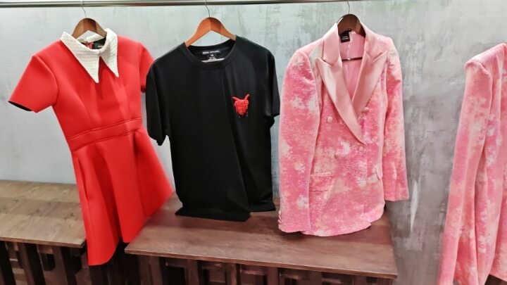 High-fashion red dresses and sequinned blazers at the Essie Apparel Rosebank store.