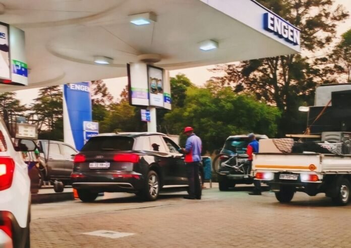 Motorists refuelling at a South African filling station; an image often associated with fuel price adjustments and national energy supply updates.