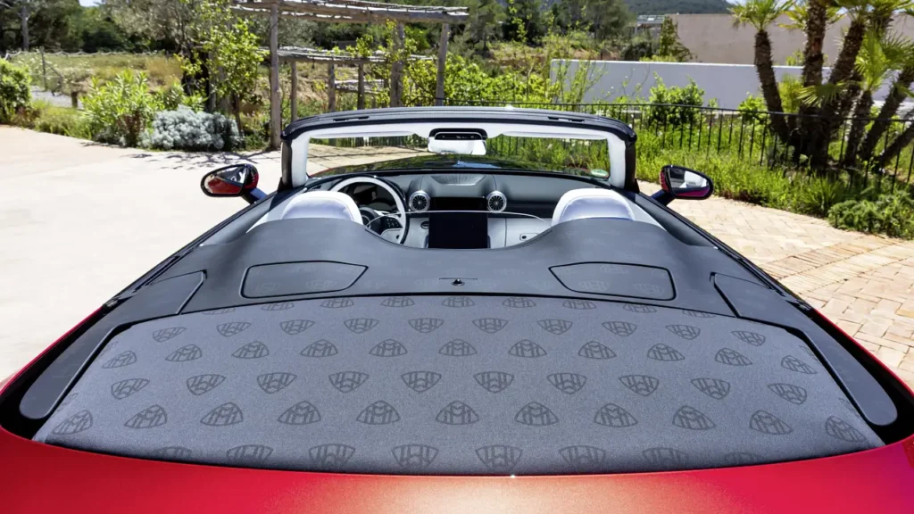 Rear view of the Mercedes-Maybach SL 680 Monogram Series showing the black aerodynamic double scoop with repeating Maybach logo patterns replacing the rear seats.