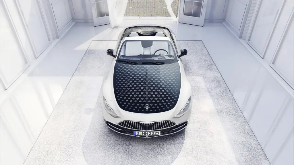 Overhead bird's-eye view of the Mercedes-Maybach SL 680 Monogram Series in White Ambience paint finish featuring the signature patterned black bonnet.