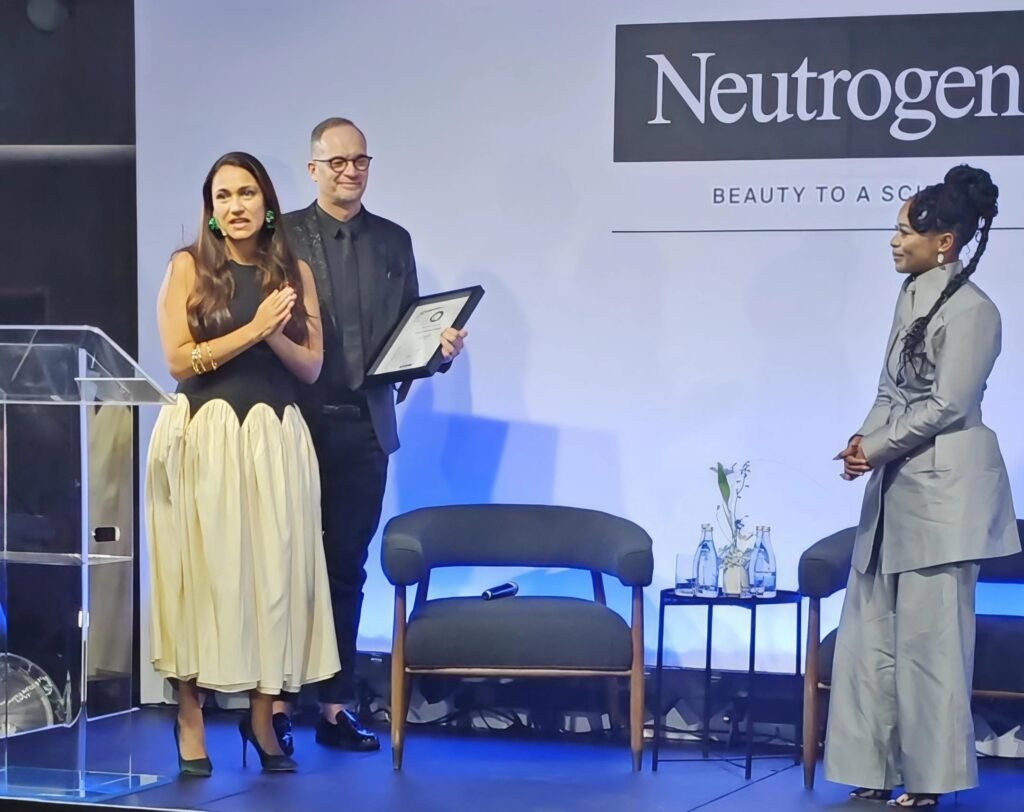 Nomzamo Mbatha receiving her official certificate at the launch of Skin Certified SA alongside Dr Willie Visser in Johannesburg.