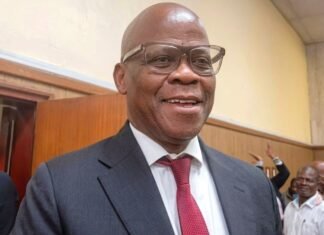 Big 5 cartel extortion case collapses: Taxi boss Joe ‘Ferrari’ Sibanyoni walks free Taxi boss Joe 'Ferrari' Sibanyoni smiling in a grey suit after walking free from court due to the big 5 cartel extortion case collapse.