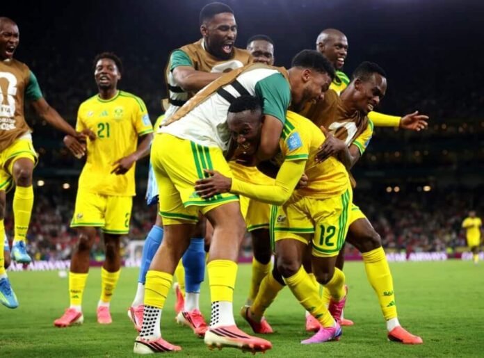 Bafana Bafana players celebrate together on the pitch after scoring against South Korea during the 2026 FIFA World Cup in Monterrey.